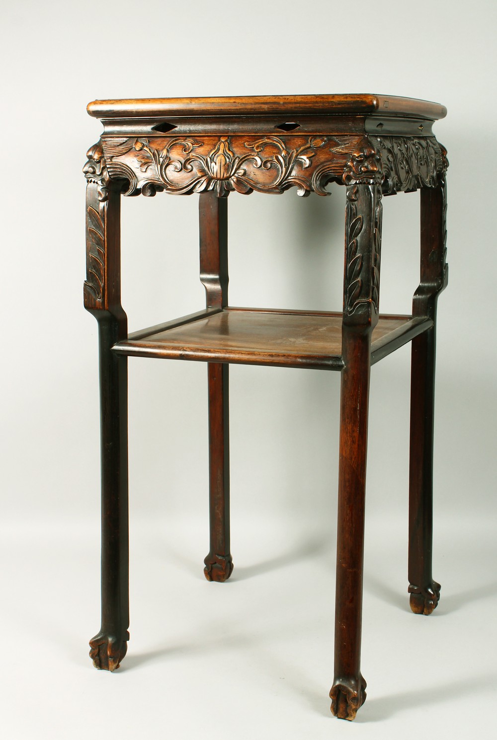 A GOOD CHINESE REDWOOD SQUARE TOP TWO TIER STAND with marble top, carved frieze and plain under