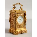 A MINIATURE BRASS CARRIAGE CLOCK with caryatid figures. 2.5ins.