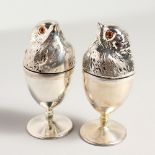 A PAIR OF SILVER PLATE CHICK EGG WARMERS.