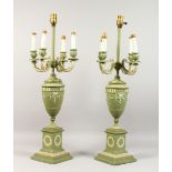 A GOOD PAIR OF ADAM DESIGN TOLEWARE CANDELABRA each with four scrolling branches on a pedestal base.