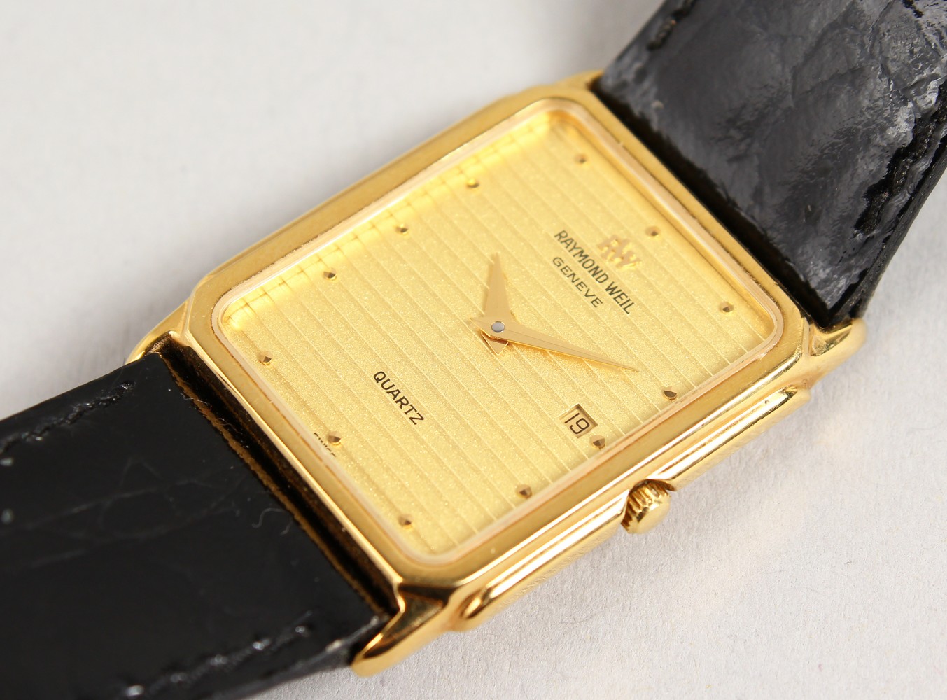 A RAYMOND WEIL WRISTWATCH AND STRAP.