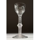 A GEORGIAN WINE GLASS, the bowl engraved with flowers, with knop stem and air twist. 5.75ins high.