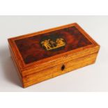 AN INLAID RECTANGULAR BOX, the top with a cupid. 7ins.