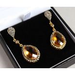 A PAIR OF 9CT GOLD AND SILVER CITRINE AND DIAMOND DROP EARRINGS.