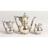 A THREE PIECE ENGRAVED TURKISH TEA SET.