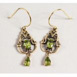 A PAIR OF 9CT GOLD PERIDOT DROP EARRINGS.