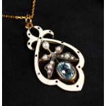 A 9CT GOLD, SILVER GILT, BLUE TOPAZ AND PEARL PENDANT on a chain.