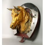 A VERY RARE FRENCH HORSE BUTCHER'S SIGN, a gilded metal horse's head in a mirrored horseshoe. 2ft