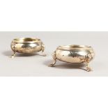 A PAIR OF GEORGE III CIRCULAR SALTS. Marks A. G. twice and two anchors.