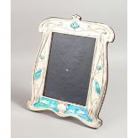 A LARGE SILVER AND BLUE ENAMEL KINGFISHER PHOTOGRAPH FRAME. 11.5ins x 9.5ins.