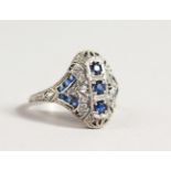 A SILVER, DIAMOND AND SAPPHIRE SET RING.