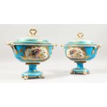 A GOOD PAIR OF SEVRES STYLE TWO HANDLED OVAL TUREENS AND COVERS with blue ground painted with