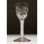 A GEORGIAN WINE GLASS, the bowl engraved with flowers and butterflies, with white air twist stem.
