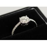 A GOOD 9CT GOLD DIAMOND RING WITH DIAMOND SHOULDERS.