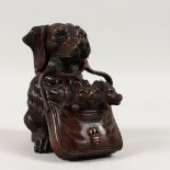 A BLACK FOREST CARVED WOOD DOG and pups in a basket. 4.5ins.