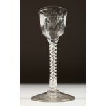 A GEORGIAN WINE GLASS, the bowl engraved with fruiting vines, with white air twist stem. 6ins high.