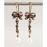 A PAIR OF 9CT GOLD PEARL AND AMETHYST BOW DROP EARRINGS.