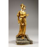 D. WATRING. A SUPERB ART DECO GILDED BRONZE AND IVORY FIGURE OF A YOUNG LADY standing reading a book