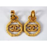 A PAIR OF CHANEL GILT EARRINGS.