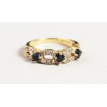 A 9CT GOLD SAPPHIRE AND DIAMOND RING.