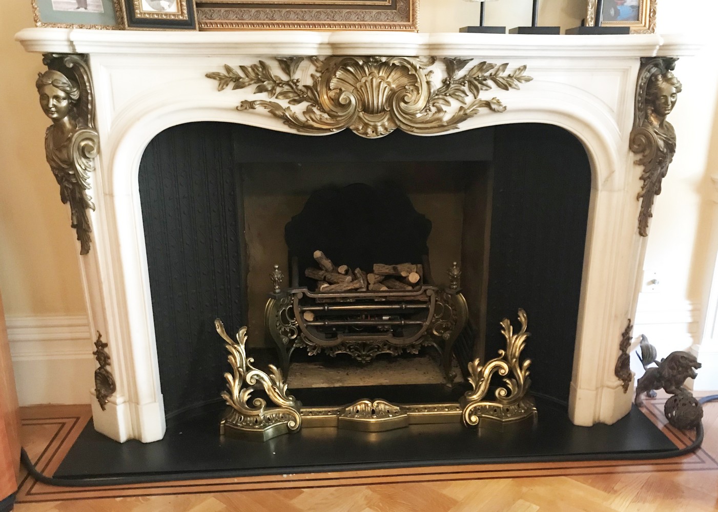 A GOOD LOUIS XVI WHITE MARBLE AND ORMOLU FIRE SURROUND, with serpentine shape mantle, the frieze