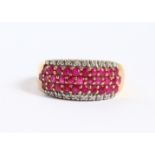 A 9CT GOLD RUBY AND DIAMOND RING.