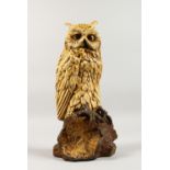 A VERY GOOD AUSTRIAN COLD CAST PAINTED OWL standing on a tree stump. Circa 1920. 10.5ins high.