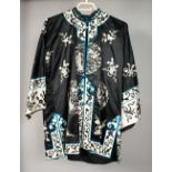 A CHINESE SILK BLACK & WHITE COAT JACKET.