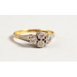 AN 18CT GOLD FOUR STONE DIAMOND RING.