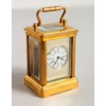 A SILVER FANCY BRASS CARRIAGE CLOCK. 2.5ins.