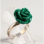 A SILVER RING with a green rose.