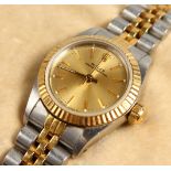 A LADIES STEEL AND GOLD ROLEX WRISTWATCH No. 491B. Model number 16013. Serial number R216476, with
