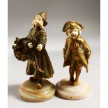 GEORGES OMERTH (act. 1895-1925) DANISH. A PAIR OF GILDED BRONZE AND IVORY FIGURES OF A YOUNG BOY and