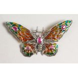 A LARGE SILVER RUBY SET BUTTERFLY BROOCH.