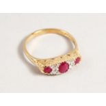 A 9CT GOLD RUBY AND DIAMOND RING.