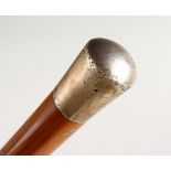 A PLAIN SILVER HANDLED WALKING CANE. London 1916. Maker J. H. 3ft long.