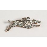 A 9CT GOLD AND SILVER JOCKEY BROOCH, set with diamonds and opals.