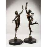 A VERY GOOD PAIR OF BRONZE FIGURES OF MERCURY AND CERES standing on octagonal marble bases. 27ins