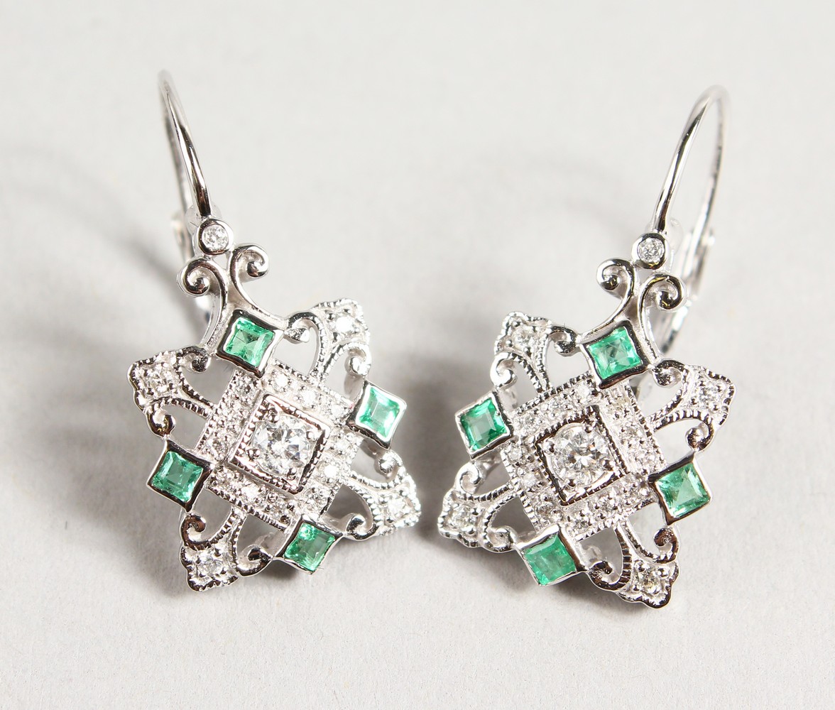 A PAIR OF 9CT GOLD, EMERALD AND DIAMOND DROP EARRINGS.