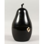 AN EBONISED PEAR SHAPED TEA CADDY. 7ins high.