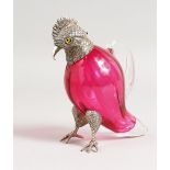 A SMALL RUBY GLASS AND PLATE PARROT CLARET JUG with plated head, hands and feet. 5.5ins high.