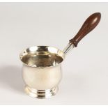 A GEORGE III BRANDY WARMER. 3ins diameter with turned wood handle. London 1782. Maker Hester