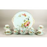 A GOOD FRENCH PORCELAIN CABARET comprising tray, teapot, sugar basin, milk jug, four cups and four