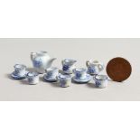 A MINIATURE BLUE AND WHITE TEA SET with teapot, milk jug, sugar basin, six cups and three saucers.