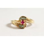 A 9CT GOLD DIAMOND AND RUBY RING.