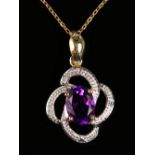 A MATCHING AMETHYST AND DIAMOND PENDANT on a chain.