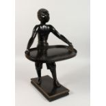 A CARVED WOOD BLACKAMOOR CARD STAND, a young boy holding a tray, on a rectangular base. 19ins high.