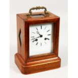 A 19TH CENTURY ROSEWOOD INLAID MANTLE CLOCK with white dial and carrying handle. 8ins high.