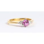 AN 18CT GOLD PINK SAPPHIRE AND DIAMOND RING.