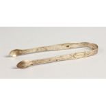 A PAIR OF GEORGE III BRIGHT CUT SUGAR TONGS.